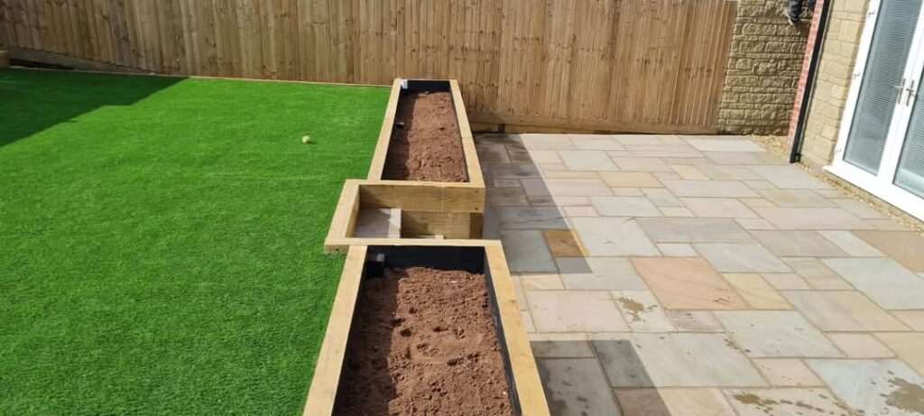 Landscaped garden features and patio